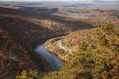 Aerial view of the Delaware Water Gap with vibrant autumn foliage and a winding river