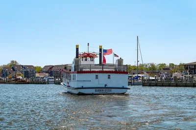Charming Annapolis harbor view featuring the iconic Harbor Queen boat and waterfront.