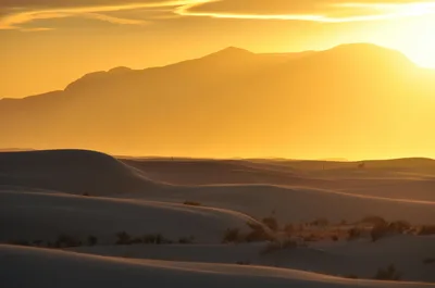 Captivating golden sunset over the wavy dunes of White Sands Desert, New Mexico.