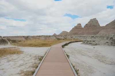 Explore the stunning landscapes of the South Dakota Badlands with this serene boardwalk view.