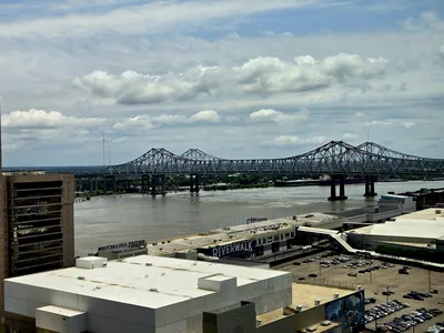 Panoramic aerial view of the Mississippi River bridge and the Baton Rouge skyline at dusk