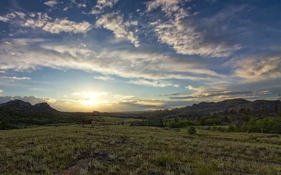 The Vedauwoo rock formations in southeastern Wyoming under a sunset sky.