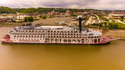 Aerial shot of the American Queen steamboat moored at Dubuque harbor on the Mississippi River