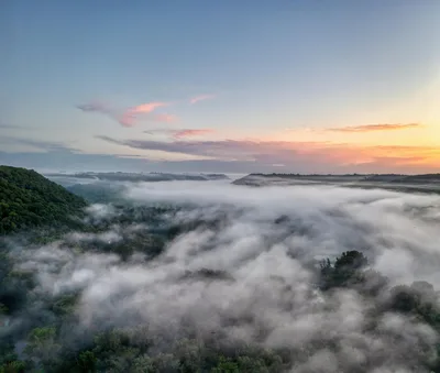 Aerial sunrise view of a misty river valley in the Driftless Area near Decorah