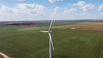 Aerial view of wind turbines and circular irrigation fields in the Texas Panhandle near Groom