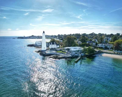 Stunning aerial view of the New London lighthouse and coastline on a sunny day in Connecticut USA.