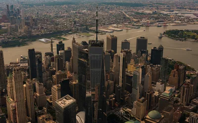Stunning aerial photo capturing Manhattan skyline overlooking the Hudson River at day.