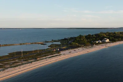 Aerial view of the tranquil Long Island coastline at sunset