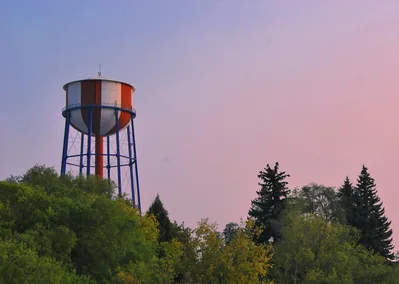 The iconic Idaho Falls water tower at sunset, a key local landmark for pilots navigating to Idaho Falls Regional Airport.