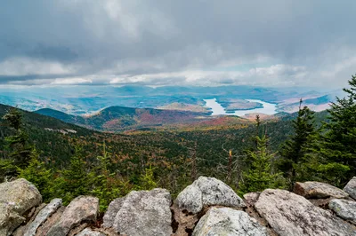 Wide aerial vista of Lake Placid and the Adirondack High Peaks in autumn foliage