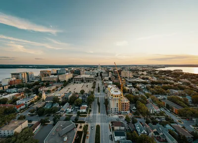 Aerial view of Madison, Wisconsin at sunset showing the isthmus and lakes
