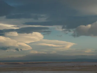 Captivating view of dramatic clouds over a vast arid landscape in Nebraska.