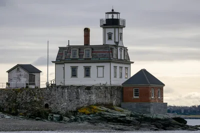 Scenic view of Rose Island Lighthouse on a cloudy day in Newport, RI.