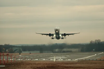 An airplane taking off from a runway in Connecticut, capturing the movement and energy of a general aviation airport.