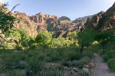 Breathtaking landscape of North Rim Trail featuring rugged cliffs and vibrant greenery.