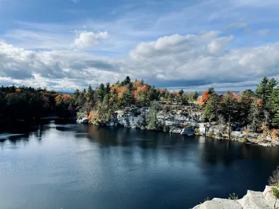 Aerial view of scenic lake surrounded by autumn foliage at Mohonk Preserve, Gardiner, NY