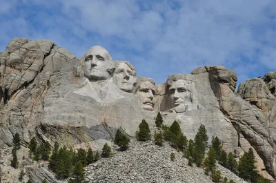 Stunning view of Mount Rushmore under a clear sky, featuring iconic presidential sculptures.