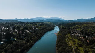 Aerial view of the Sacramento River valley and distant mountains near Red Bluff