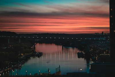 Sunset over the Mississippi River in St. Paul with a historic bridge in the background