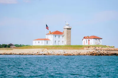 Watch Hill Lighthouse on the rocky coast of Westerly, Rhode Island, a key landmark for pilots flying along the southern coast.