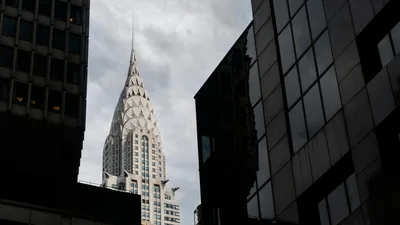 The iconic Chrysler Building surrounded by other skyscrapers in New York City.