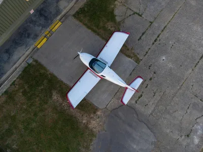 Aerial view of a small GA airplane on a runway