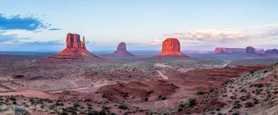 Majestic red rock formations in Monument Valley at sunset, Arizona.